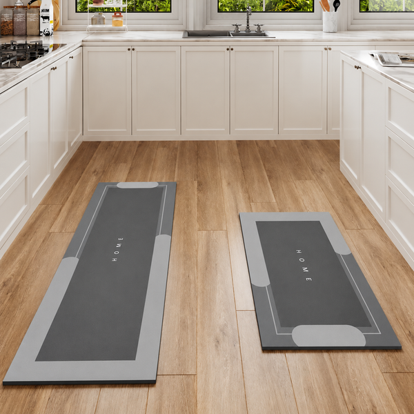 Two gray Mattona kitchen runner mats on a wooden kitchen floor