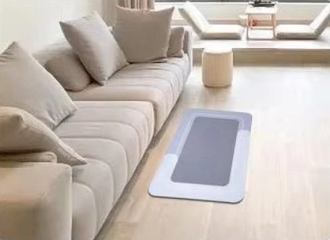 plain Mattona mat beside a sofa in a living room